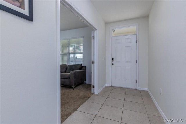 483 W Runyon Loop, Beverly Hills, FL 34465 - foyer entrance featuring light tile patterned flooring, baseboards, and light colored carpet