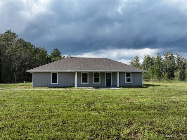 ranch-style house with a front yard