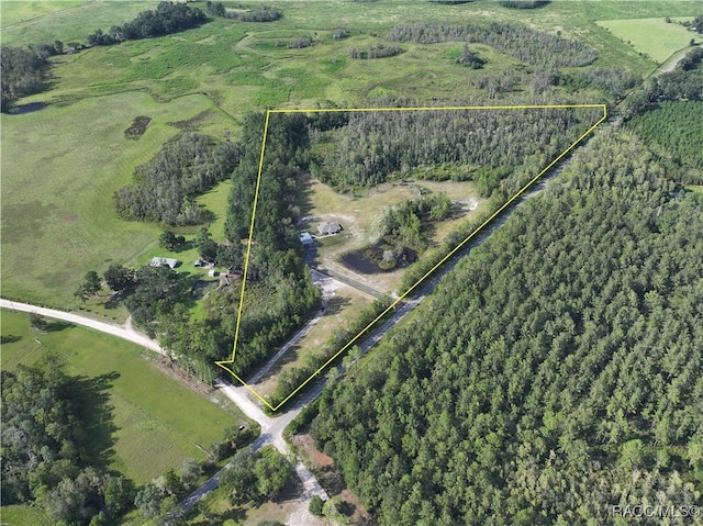 birds eye view of property featuring a rural view