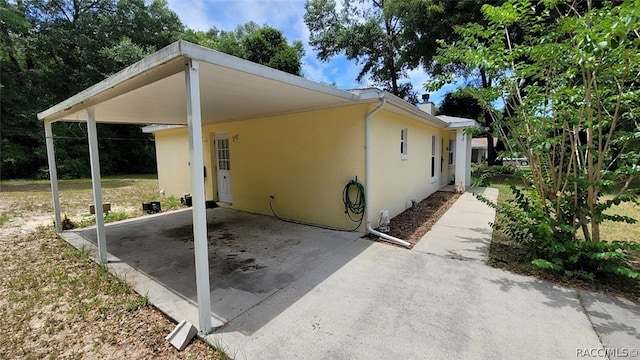 exterior space featuring a carport