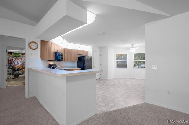 604 Morse St, Inverness, FL 34452 - kitchen featuring black appliances, light countertops, ceiling fan, a peninsula, and baseboards
