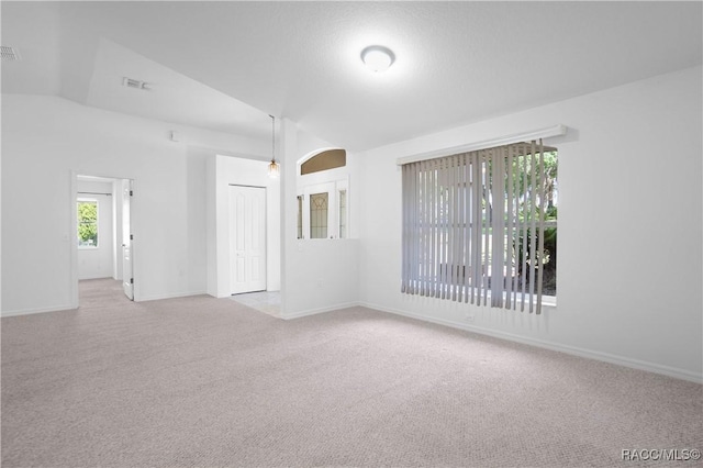 604 Morse St, Inverness, FL 34452 - carpeted spare room with baseboards and vaulted ceiling