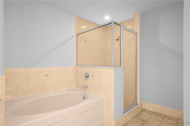 604 Morse St, Inverness, FL 34452 - full bath with a shower stall, a garden tub, baseboards, and recessed lighting