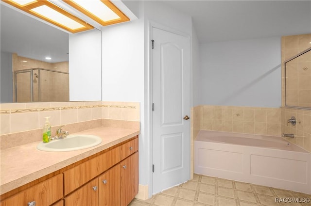 604 Morse St, Inverness, FL 34452 - full bathroom with a stall shower, tile patterned floors, a garden tub, vanity, and tasteful backsplash