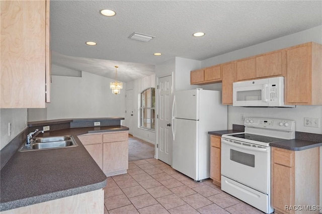 kitchen with light brown cabinets, dark countertops, white appliances, recessed lighting, and a sink