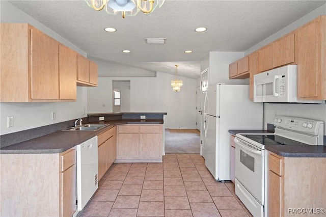 kitchen featuring an inviting chandelier, light brown cabinetry, dark countertops, and white appliances