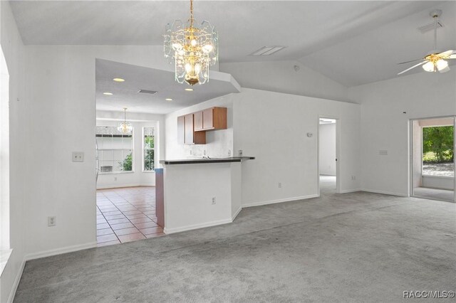kitchen with carpet floors, open floor plan, plenty of natural light, and lofted ceiling