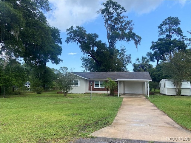 5175 E Tangelo Ln, Inverness, FL 34453 - view of front of home with driveway, a front yard, and a carport