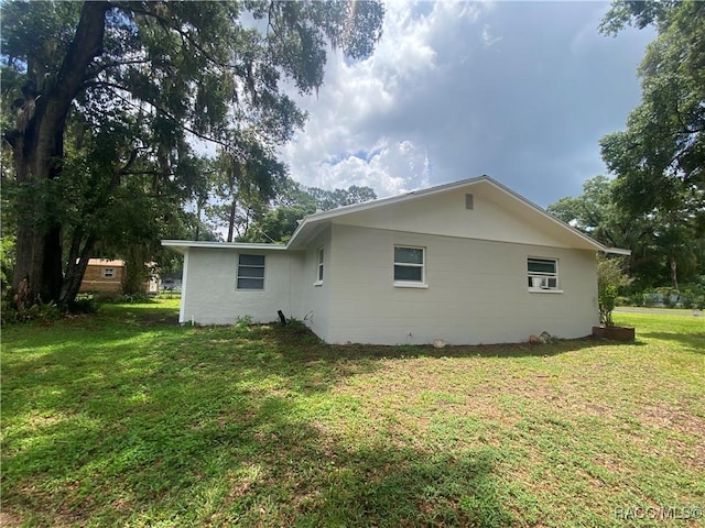 5175 E Tangelo Ln, Inverness, FL 34453 - back of house featuring a yard