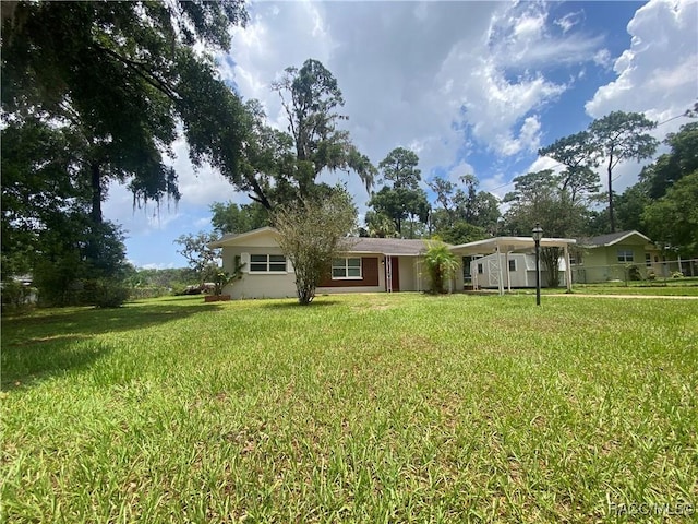 5175 E Tangelo Ln, Inverness, FL 34453 - view of front of house with a front yard