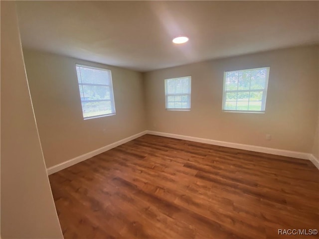 5175 E Tangelo Ln, Inverness, FL 34453 - empty room with plenty of natural light, baseboards, wood finished floors, and recessed lighting