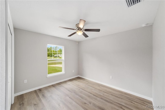 2114 W Magenta Dr, Citrus Springs, FL 34434 - empty room with baseboards, ceiling fan, light wood-style flooring, and visible vents