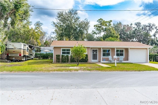 view of front of house featuring a garage and a front yard