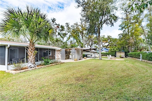 view of yard with a sunroom