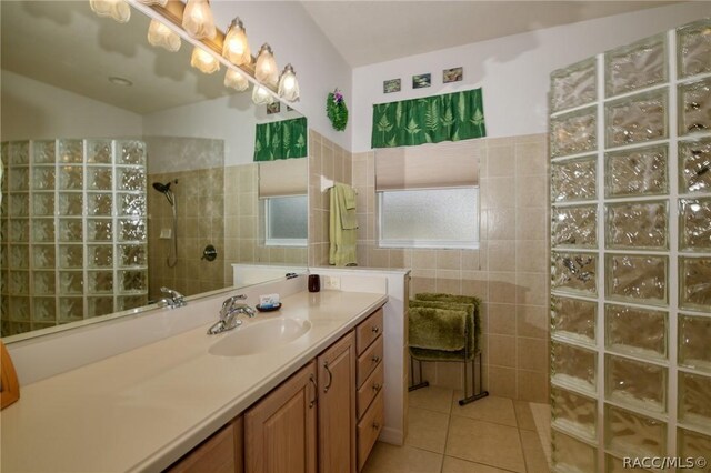 1112 W Diamond Shore Loop Unit 45, Hernando, FL 34442 - bathroom featuring vanity, walk in shower, tile patterned floors, and tile walls