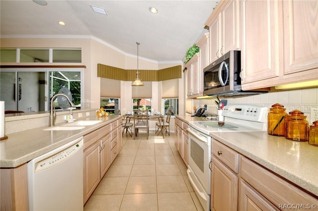 1112 W Diamond Shore Loop Unit 45, Hernando, FL 34442 - kitchen with white appliances, light tile patterned floors, vaulted ceiling, tasteful backsplash, and healthy amount of natural light