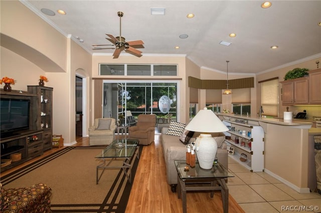 1112 W Diamond Shore Loop Unit 45, Hernando, FL 34442 - living room with ornamental molding, a ceiling fan, recessed lighting, vaulted ceiling, and light wood-style floors