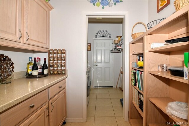 1112 W Diamond Shore Loop Unit 45, Hernando, FL 34442 - kitchen featuring open shelves, light tile patterned floors, light brown cabinets, and light countertops
