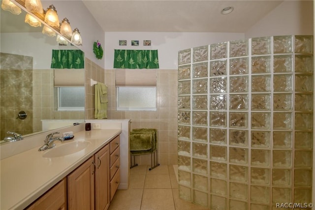 1112 W Diamond Shore Loop Unit 45, Hernando, FL 34442 - bathroom featuring vanity, a walk in shower, tile patterned flooring, and tile walls