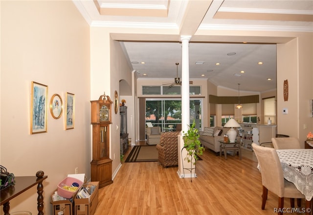 interior space featuring ornate columns, crown molding, and light wood-type flooring