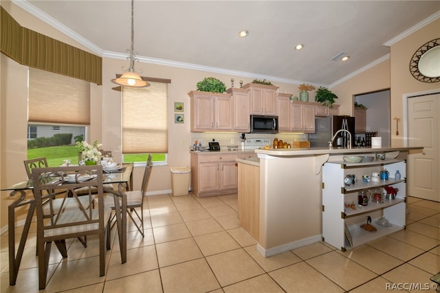 kitchen with light brown cabinets, stainless steel appliances, decorative light fixtures, light tile patterned floors, and ornamental molding