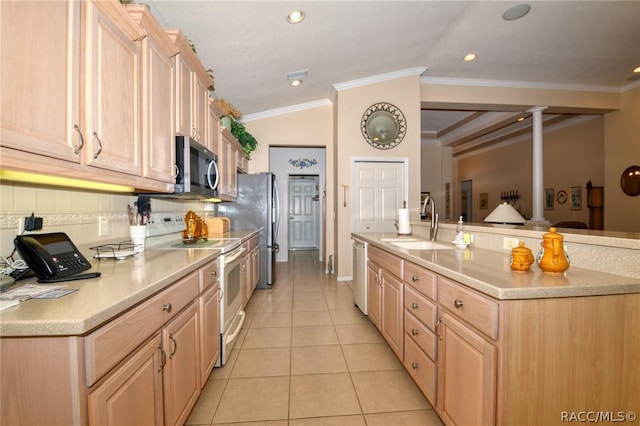 1112 W Diamond Shore Loop Unit 45, Hernando, FL 34442 - kitchen with stainless steel appliances, light brown cabinets, light countertops, light tile patterned flooring, and crown molding