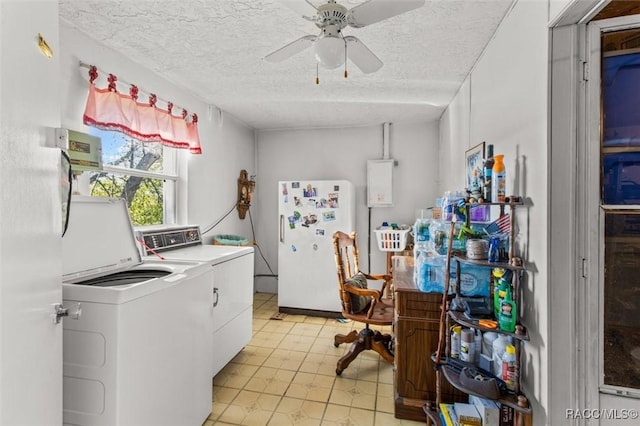 washroom with a textured ceiling, laundry area, a ceiling fan, and washing machine and clothes dryer