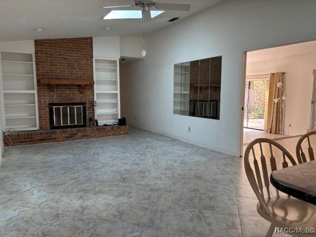 living room featuring ceiling fan, lofted ceiling, a brick fireplace, and built in features