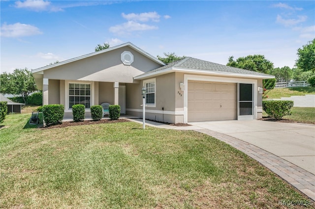 795 W Toucan Loop, Hernando, FL 34442 - ranch-style house with a garage, stucco siding, concrete driveway, a front lawn, and a shingled roof