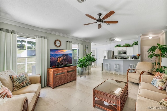 795 W Toucan Loop, Hernando, FL 34442 - living room featuring a ceiling fan, ornamental molding, healthy amount of natural light, vaulted ceiling, and light tile patterned floors