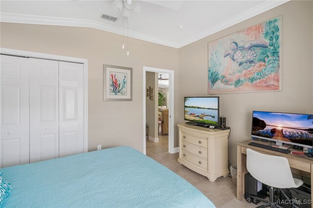 795 W Toucan Loop, Hernando, FL 34442 - bedroom featuring crown molding, a closet, light tile patterned floors, ceiling fan, and baseboards