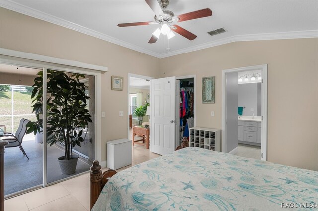 795 W Toucan Loop, Hernando, FL 34442 - bedroom featuring crown molding, access to exterior, ensuite bathroom, light tile patterned flooring, and a closet