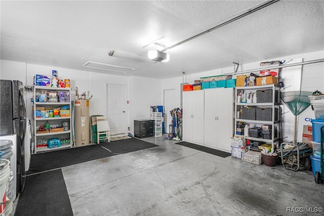 795 W Toucan Loop, Hernando, FL 34442 - garage with electric water heater, a garage door opener, and refrigerator