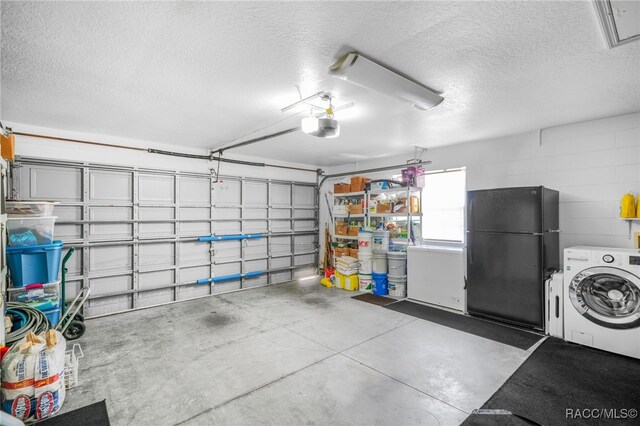 795 W Toucan Loop, Hernando, FL 34442 - garage with washer / dryer, freestanding refrigerator, a garage door opener, and concrete block wall