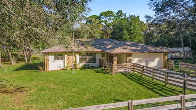 ranch-style house with a front yard and a garage