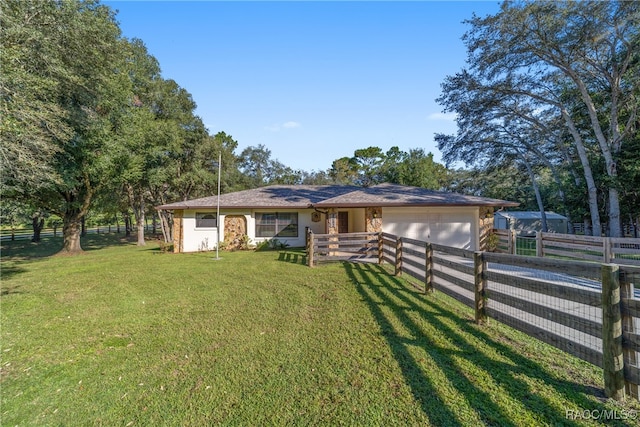 ranch-style house with a front lawn and a garage