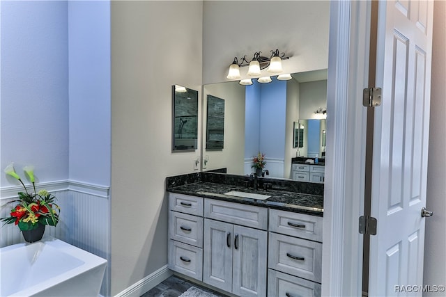 bathroom featuring a tub and vanity