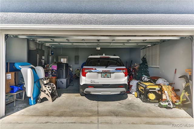 garage with electric panel and heating unit