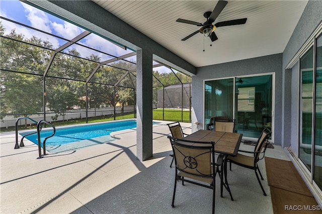 exterior space featuring a lanai, ceiling fan, and a patio area