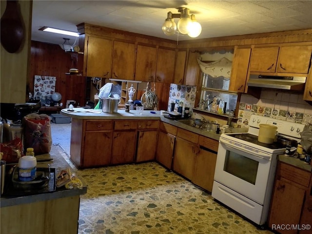 kitchen featuring white range with electric stovetop and sink