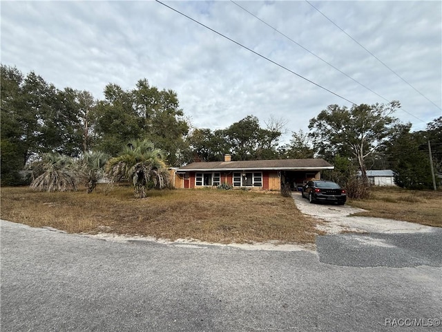 view of front of home featuring a carport