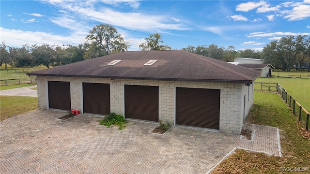 garage with a lawn