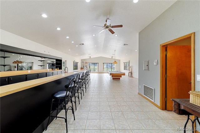 bar with ceiling fan, hanging light fixtures, billiards, and vaulted ceiling