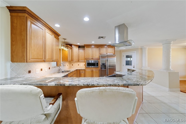 kitchen featuring kitchen peninsula, appliances with stainless steel finishes, decorative backsplash, island exhaust hood, and crown molding