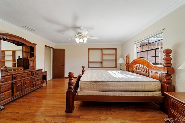 bedroom with ceiling fan, crown molding, and light hardwood / wood-style flooring