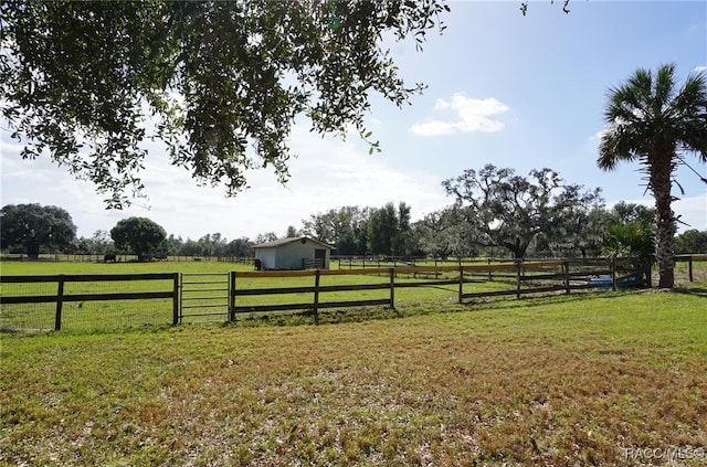 view of yard with a rural view