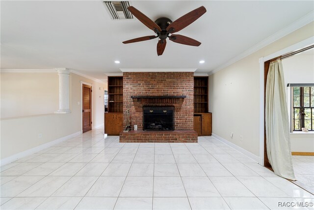 unfurnished living room with ceiling fan, a fireplace, light tile patterned floors, and ornamental molding