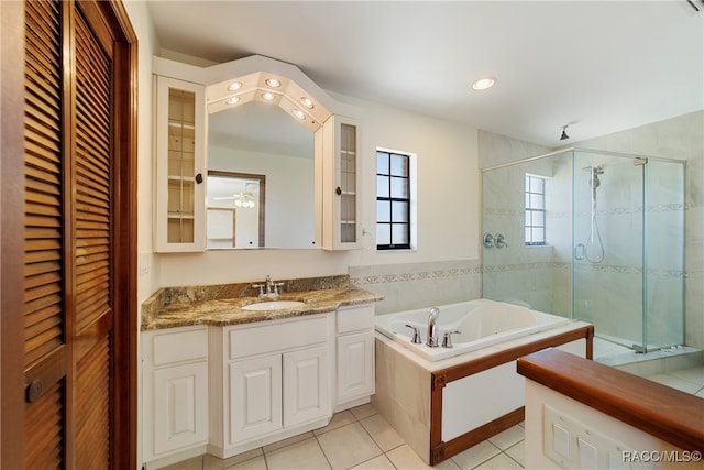 bathroom featuring tile patterned floors, vanity, and independent shower and bath