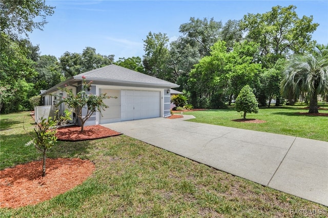 ranch-style home with a garage and a front lawn