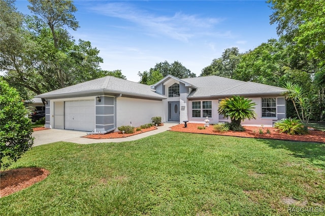 ranch-style home with a front lawn and a garage